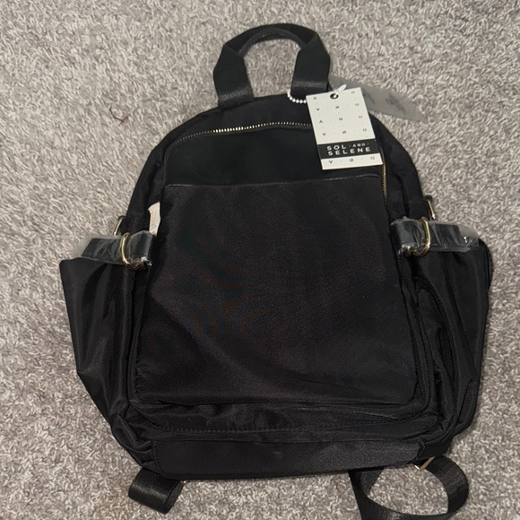 Sleek Black Backpack with Gold Zippers - Picture 6 of 10